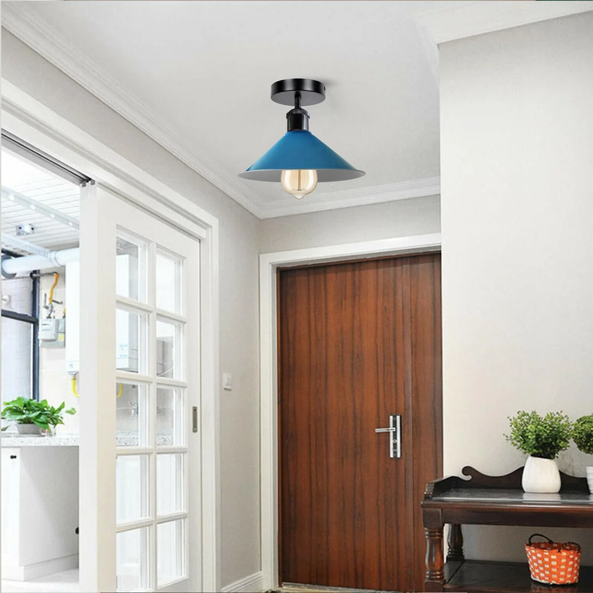 Modern industrial semi flush mount light with white metal cone shade and sleek black metal rim, hanging over a ceiling.