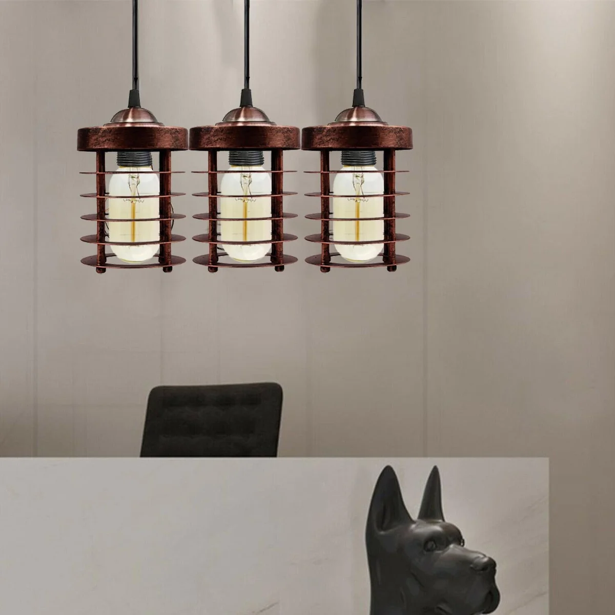 Black pendant lamp with metal spiral cage hanging from ceiling, rustic industrial style