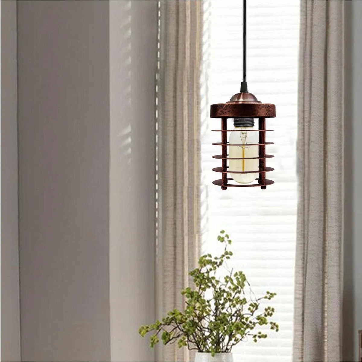 Adjustable pendant light: black metal spiral cage with hand‑painted finish, hanging from 95 cm cable, perfect for living room.