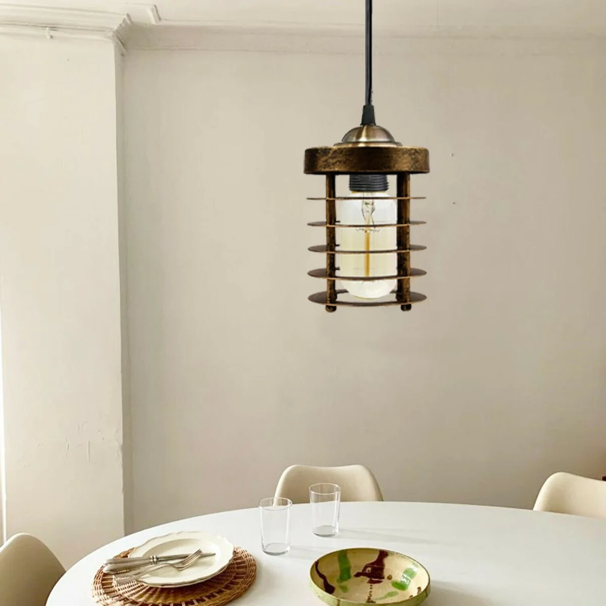 Industrial pendant light featuring a black metal spiral cage with antique hand‑painted finish, hanging on a 95 cm cable.