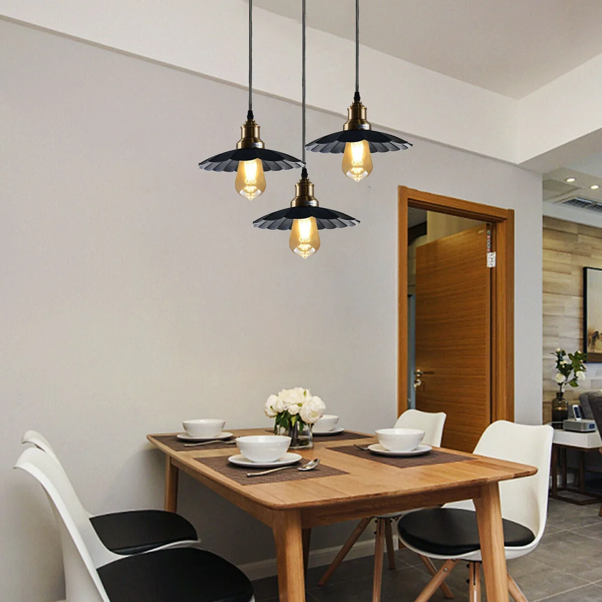 Black ceiling pendant light with three wavy metal arms and long PVC cable