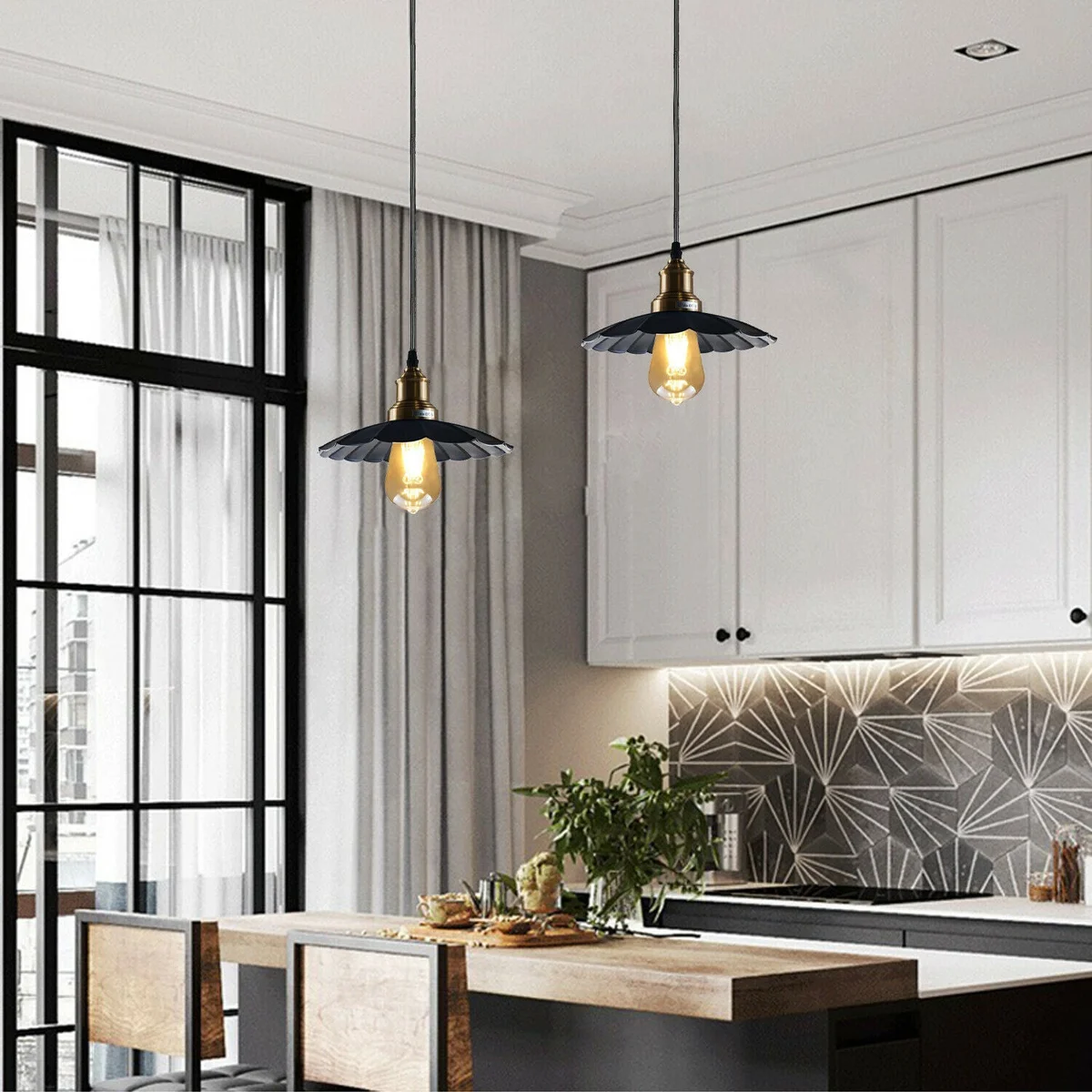 Black ceiling pendant light with wavy metal design hanging from a 95cm PVC cable, round base and light shade.