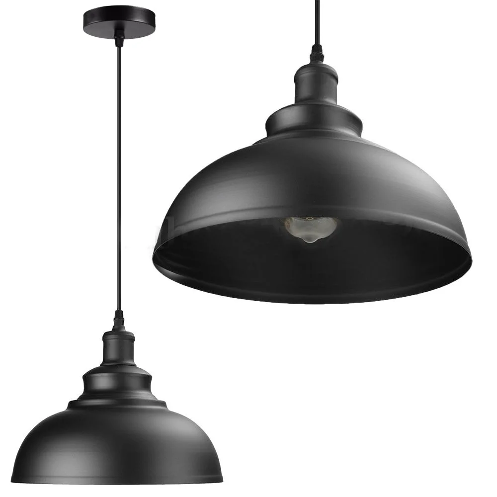 Black industrial kitchen pendant light with round iron shade, fabric‑covered cable, black finish.