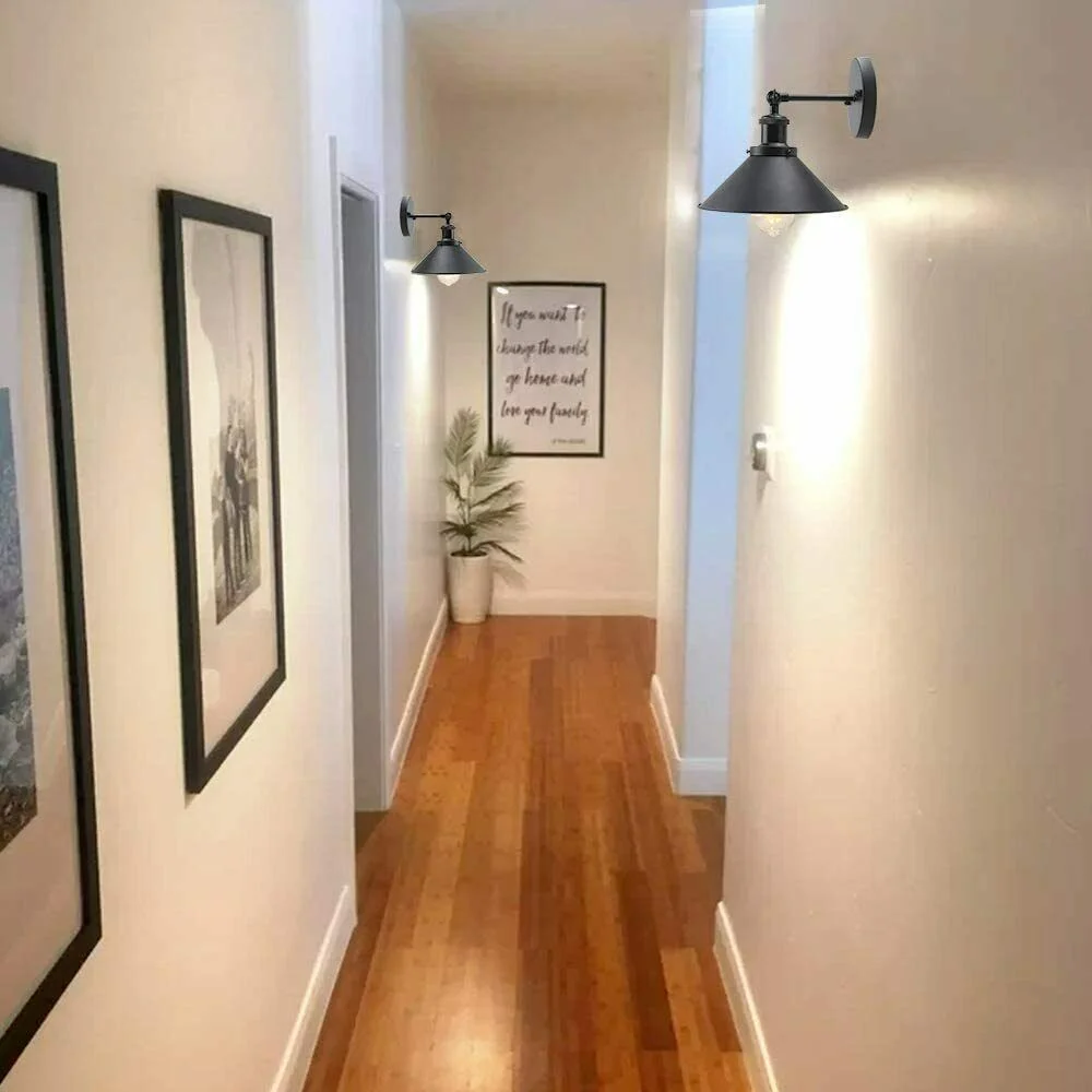 Black wall sconce with vintage cone shade, metal body, E27 base and wall arm, ideal for indoor décor.