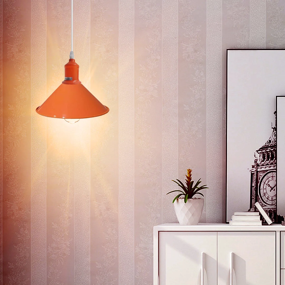 Orange painted metal adjustable pendant lamp with silver polished dome shade, 22cm diameter and 115cm height.