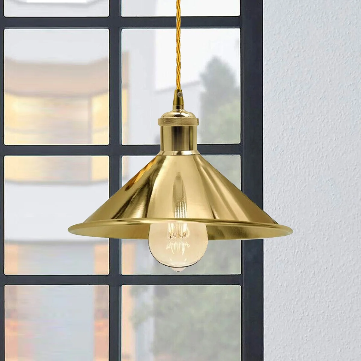 Stylish gold pendant lights with a sleek dome shade hanging from a thin cable, featuring a gold finish and minimalist design.
