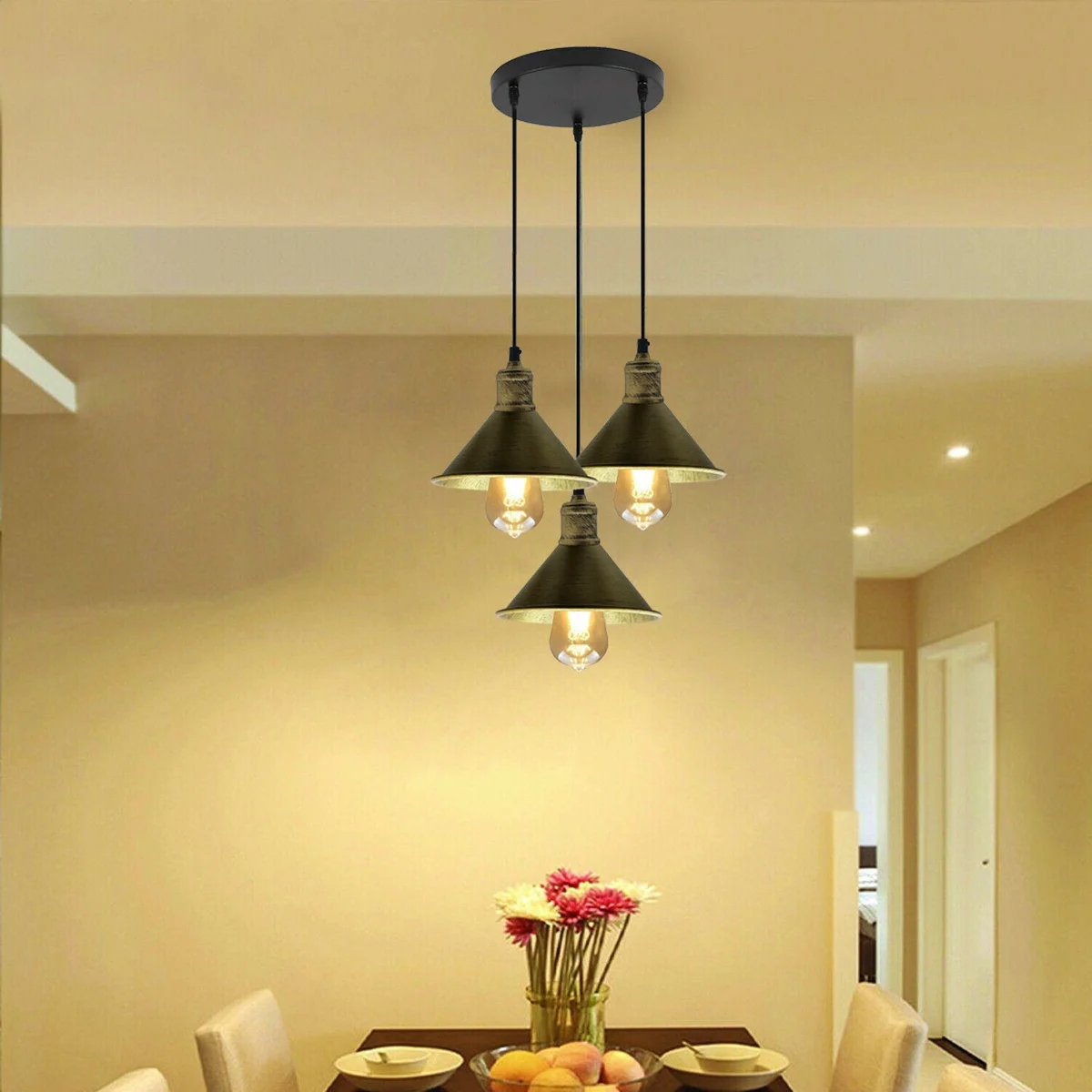 Black and brass 3‑head pendant chandelier with metal cage frame and 95 cm PVC cable, finished in black and brushed brass.