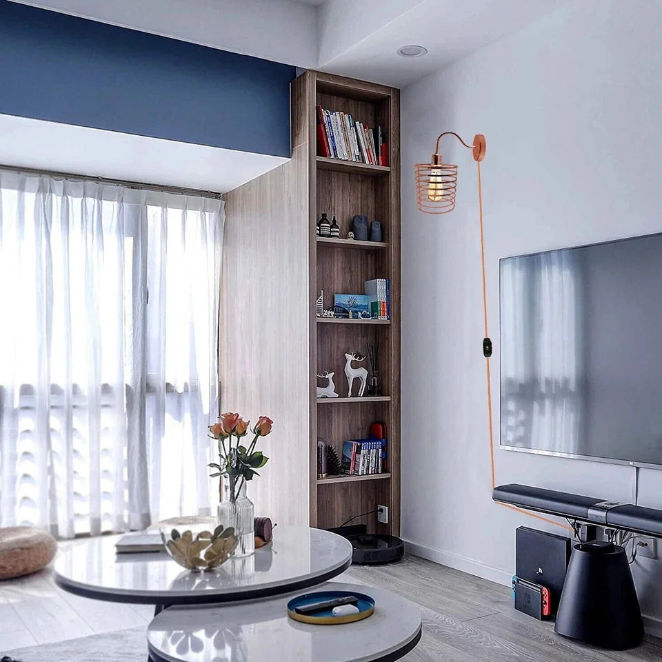 Rose gold retro industrial plug in wall lamp with metal frame and round shade, corded and wall‑mounted.