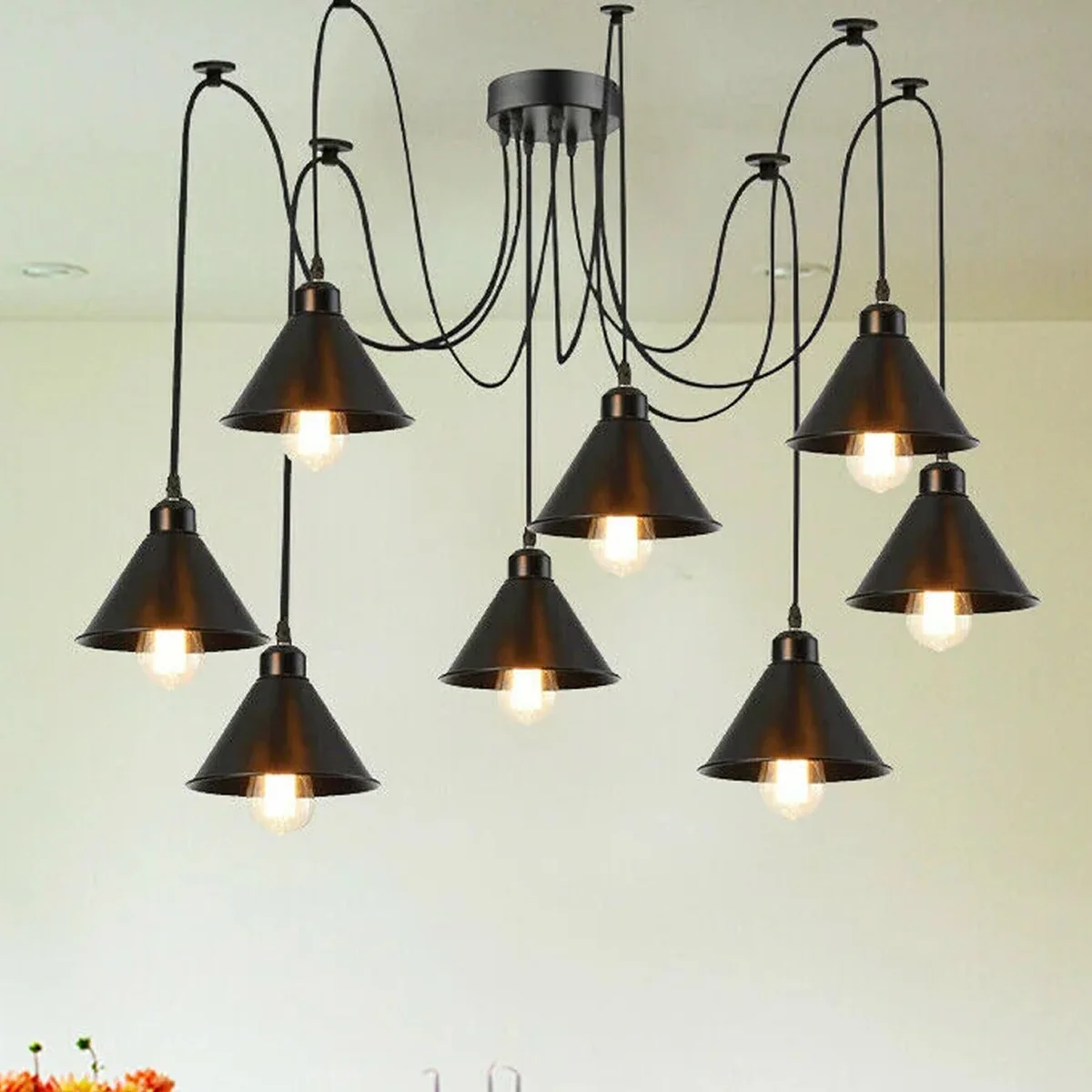 8 way ceiling pendant light featuring black metal frames and eight vintage filament lamp shades