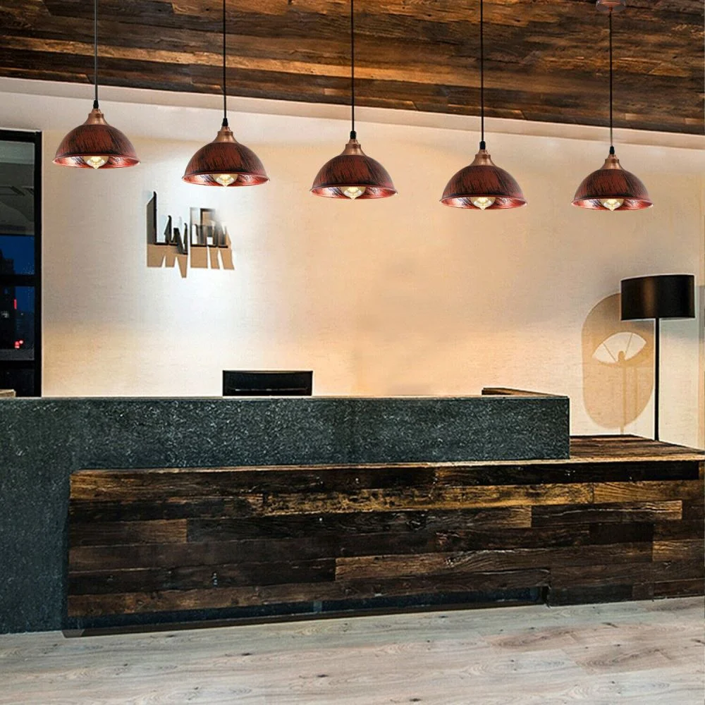 Modern iron pendant lamp in black finish hangs from ceiling, sleek design casting warm romantic glow over interior