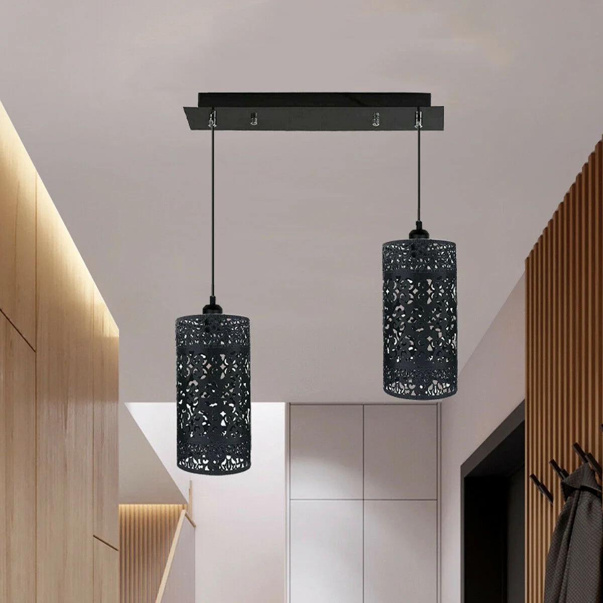 Black pendant light with double metal cages, quatrefoil design, hanging from 95cm cable.