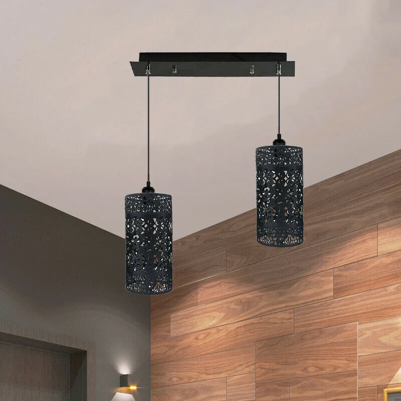 Black metal cage pendant light with quattrofoil design, 40cm diameter, brushed rustic finish hanging from ceiling