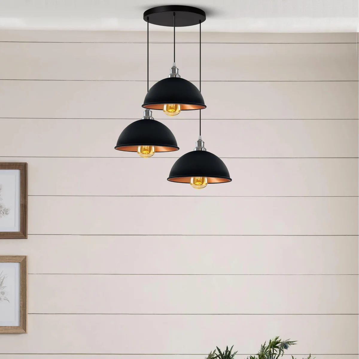 Industrial pendant light with three black metal shades, brass socket accents, and 95‑cm PVC cables