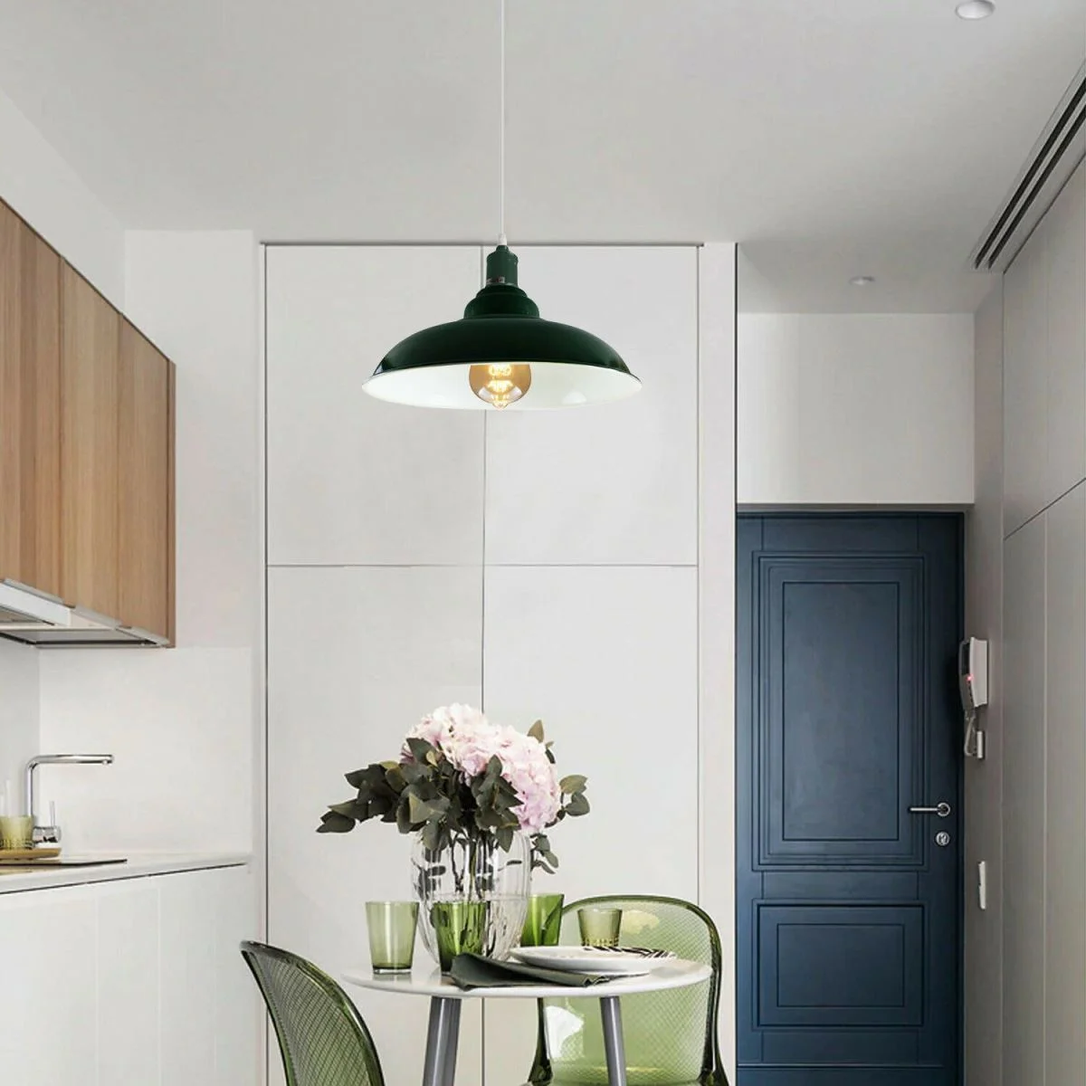 Green modern vintage pendant lamp with metal dome and white interior, angled for sloped ceilings