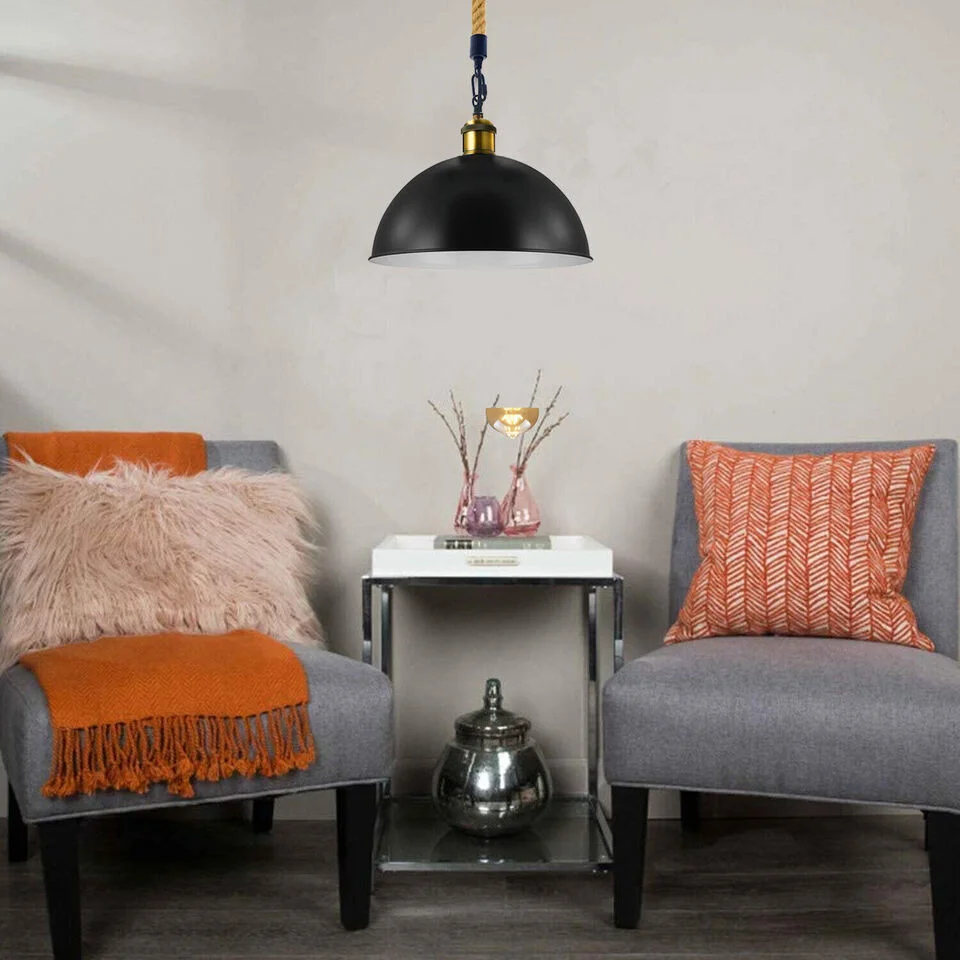 Vintage rural style kitchen pendant lighting with metal lampshade and hemp rope hangs above a table.