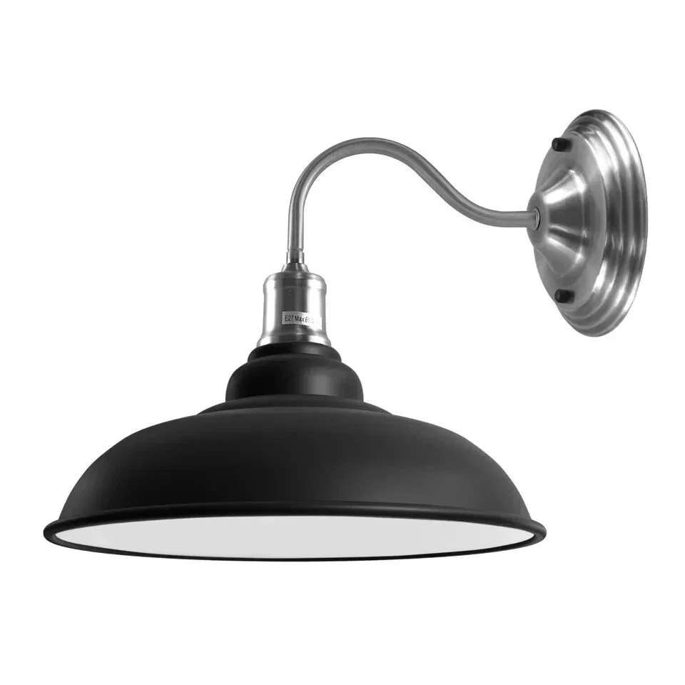 Black thickened metal goose neck wall light with black lampshade mounted on wall, vintage industrial style.