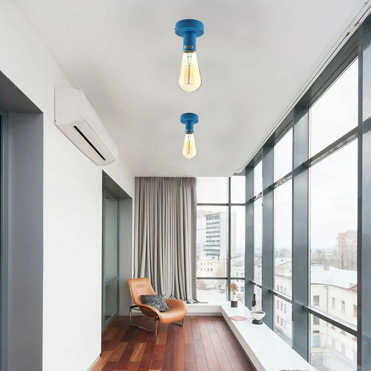 Blue flush mount ceiling light with metal plate and E27 socket, circular design and recessed mounting.