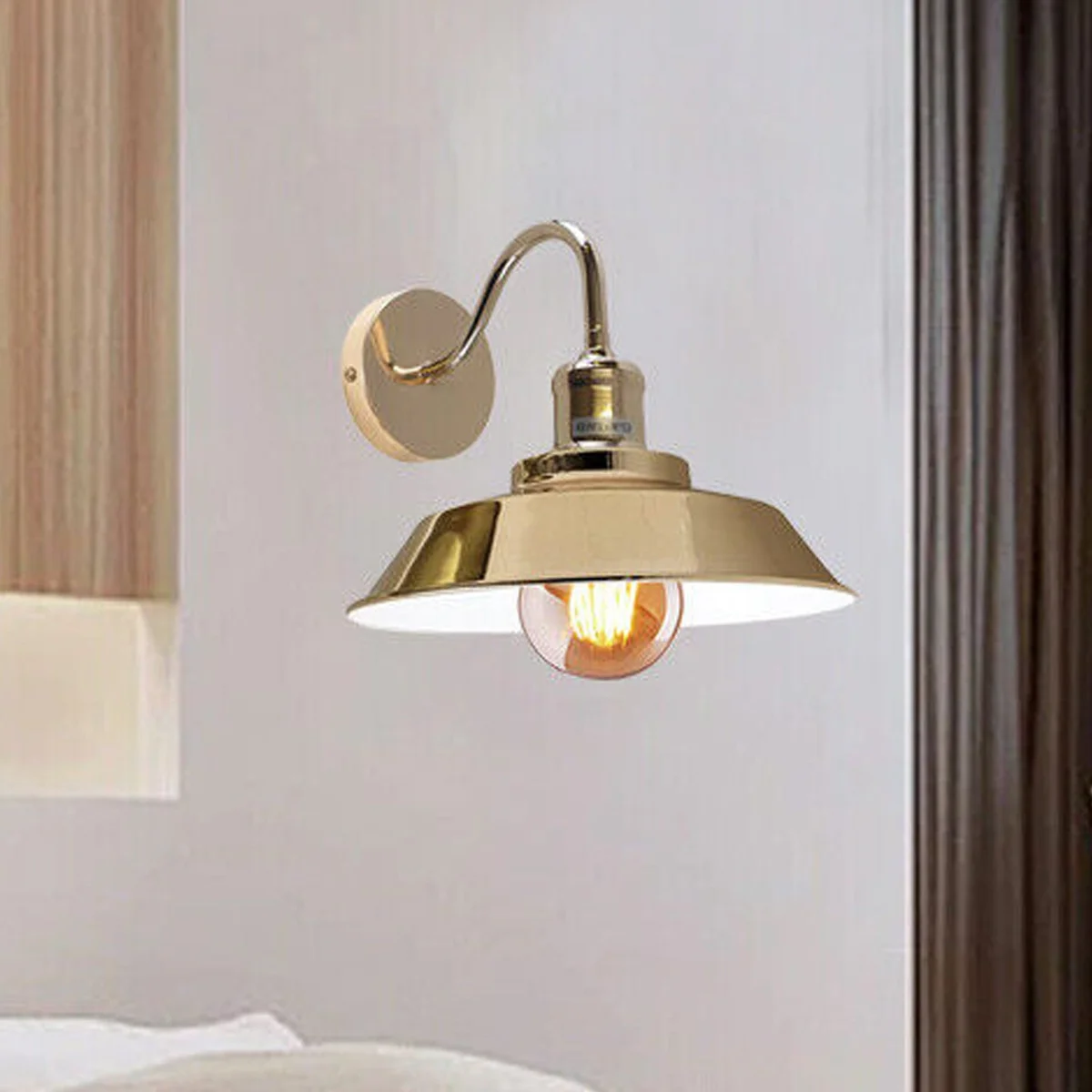 Vintage industrial wall sconce in French Gold, matte exterior, white interior bowl shade, curved metal arm, E27 bulb holder