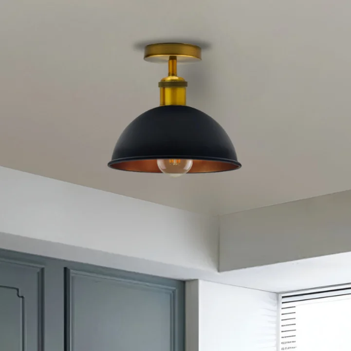 Flush‑mounted black gold ceiling light with metal shade, cylindrical base, recessed in ceiling, bulb not included