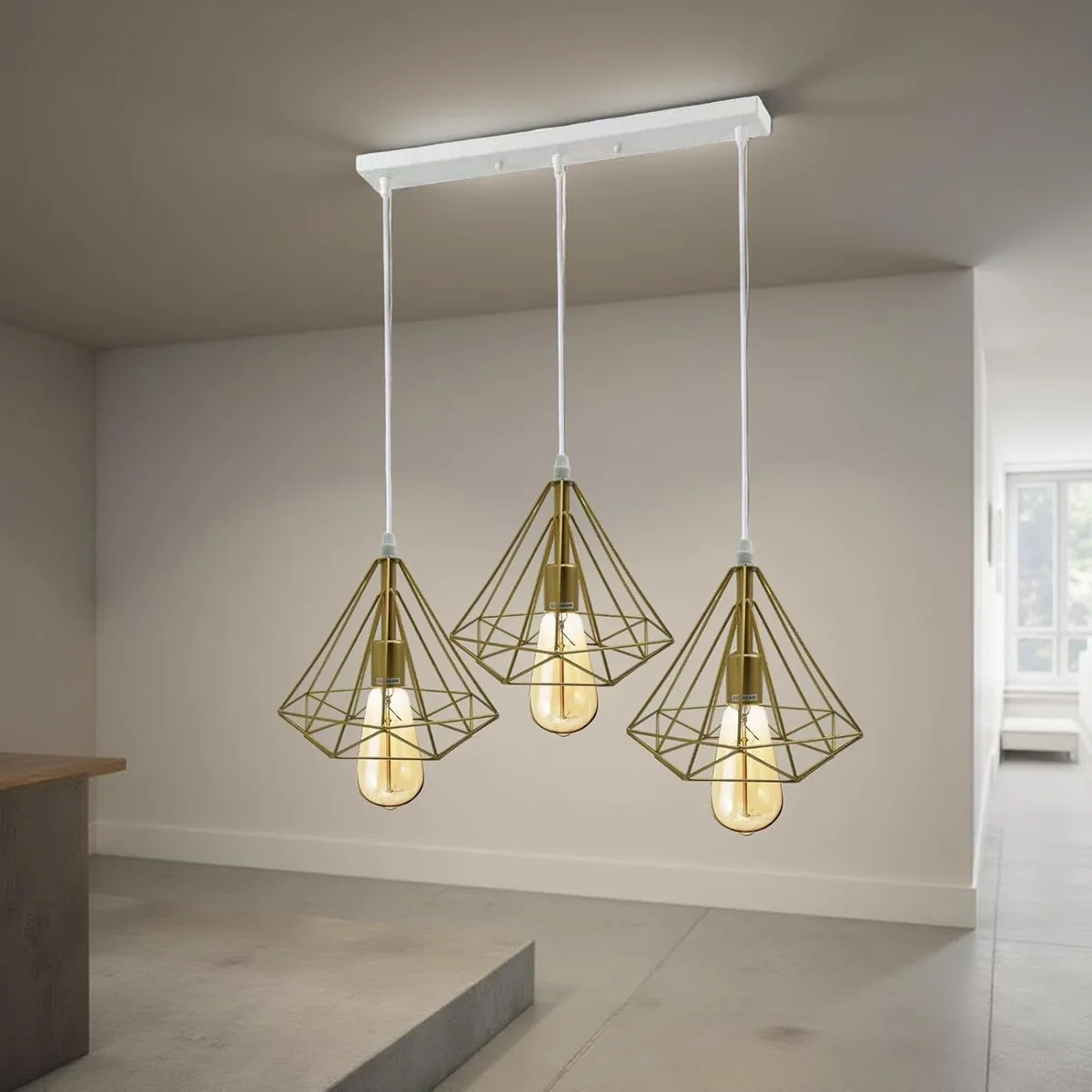 Three‑cage modern gold ceiling light with Edison filament style, metal frame, suspended from 95 cm cable.