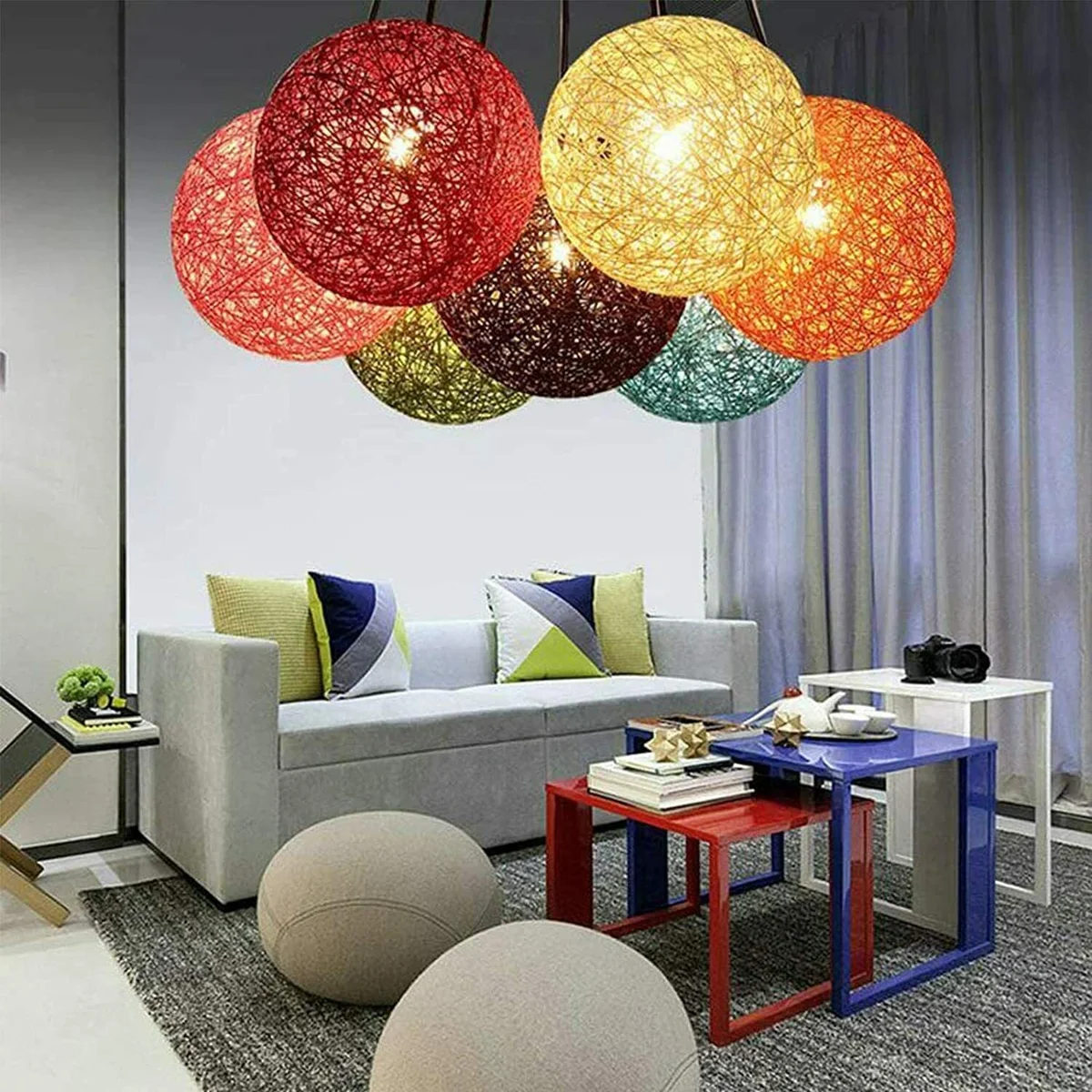 Red rattan pendant light on metal holder with 95cm cord, 20cm diameter wicker shade hanging from ceiling.