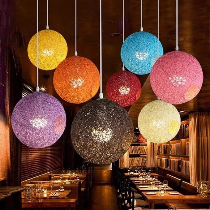 Yellow woven lampshade made of iron and rattan, round silhouette with light and hanging wire, perfect pendant illumination.