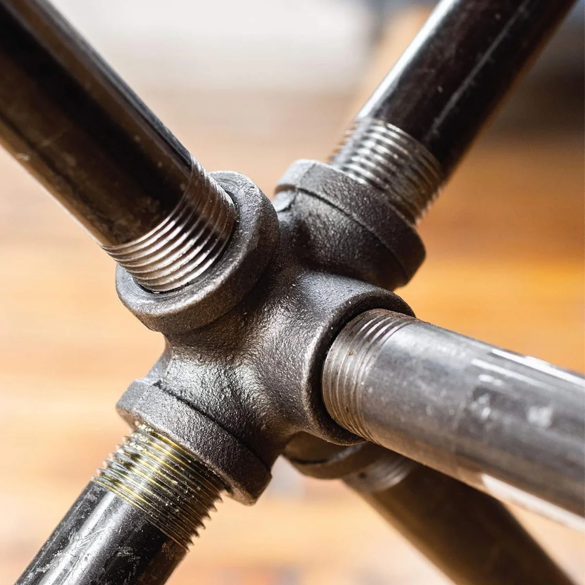 5-way black iron pipe fitting connector with matte black powder coating for 3/4-inch threaded pipes