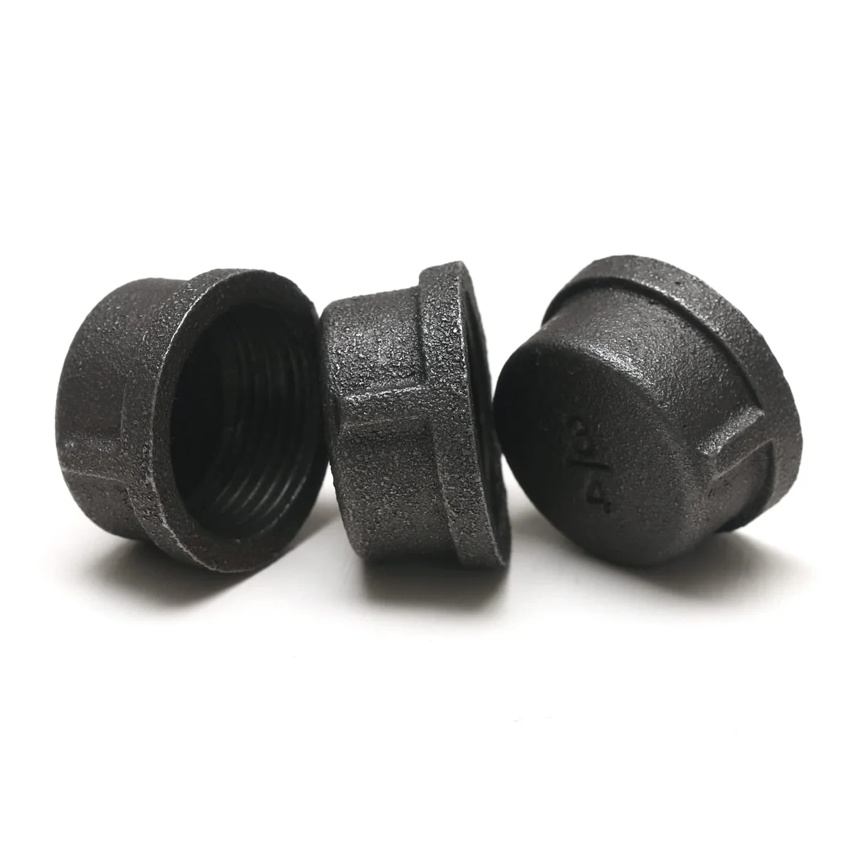 Black cast iron pipe fitting cap with threaded screw connection, suitable for DIY projects and vintage decor.