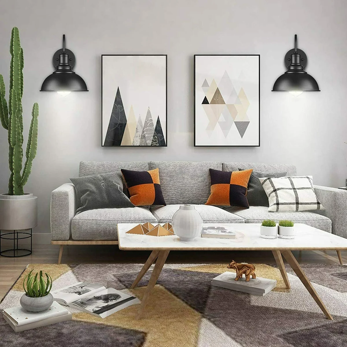 Black industrial style wall light fixture with metal shade mounted on a white living room wall, showing plug and dimmer switch
