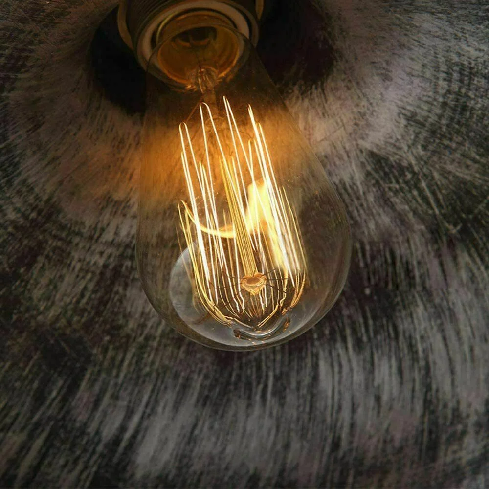 Brushed silver retro pendant lamp with metal shade and hemp rope hanging from ceiling, vintage industrial style lighting