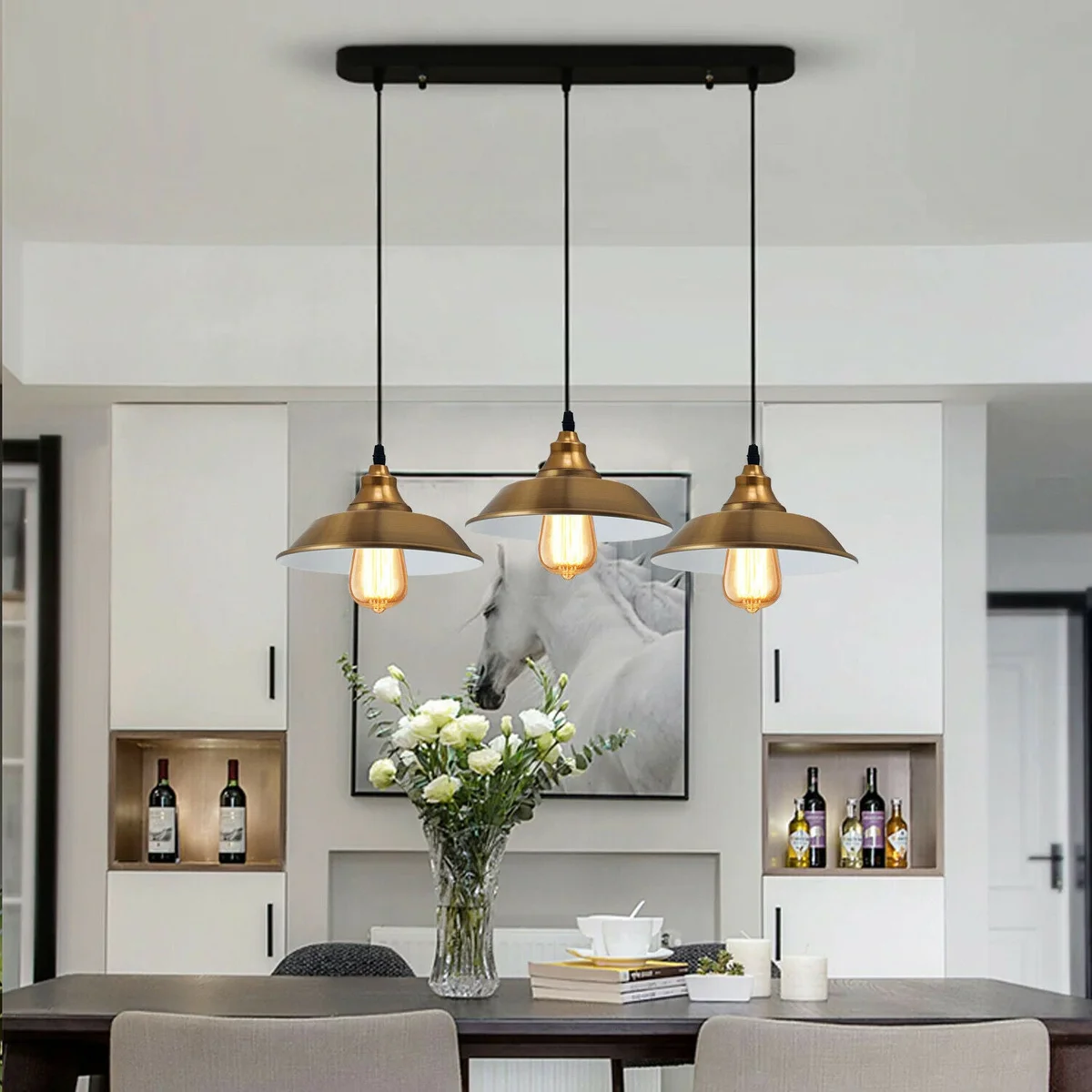 Yellow brass multi outlet pendant light with three adjustable metal lampshades and E27 bulb fittings hanging from ceiling rose