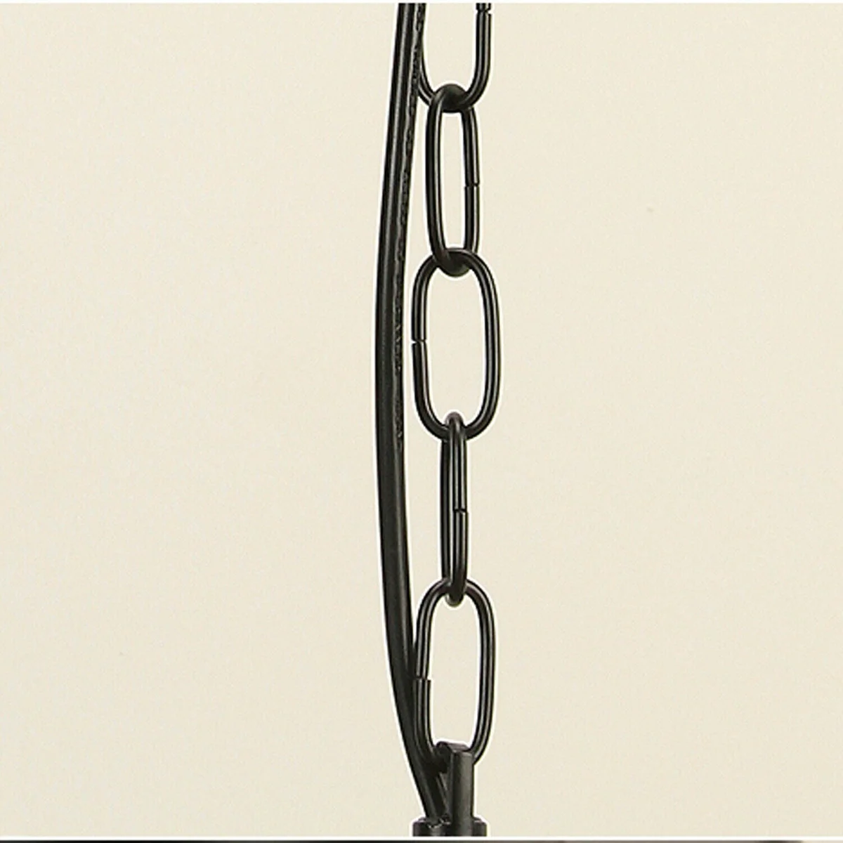 Black metal vintage adjustable chain pendant light with dome shade hanging from ceiling rose in industrial style