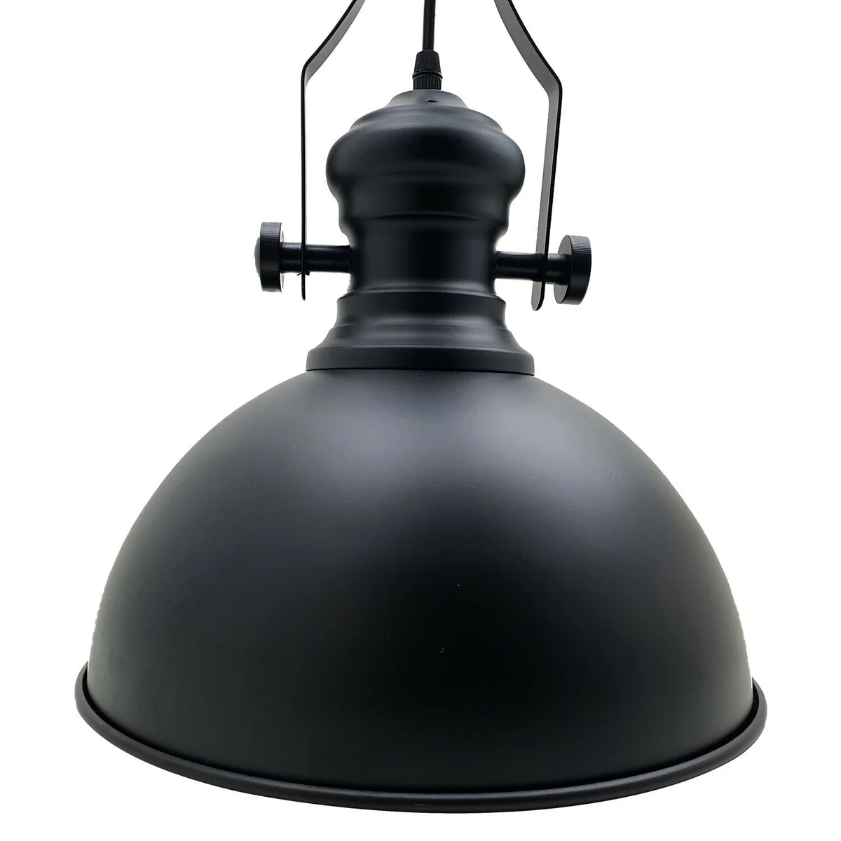 Black metal industrial pendant ceiling light with dome shade, adjustable chain, and white inner finish hanging in loft space