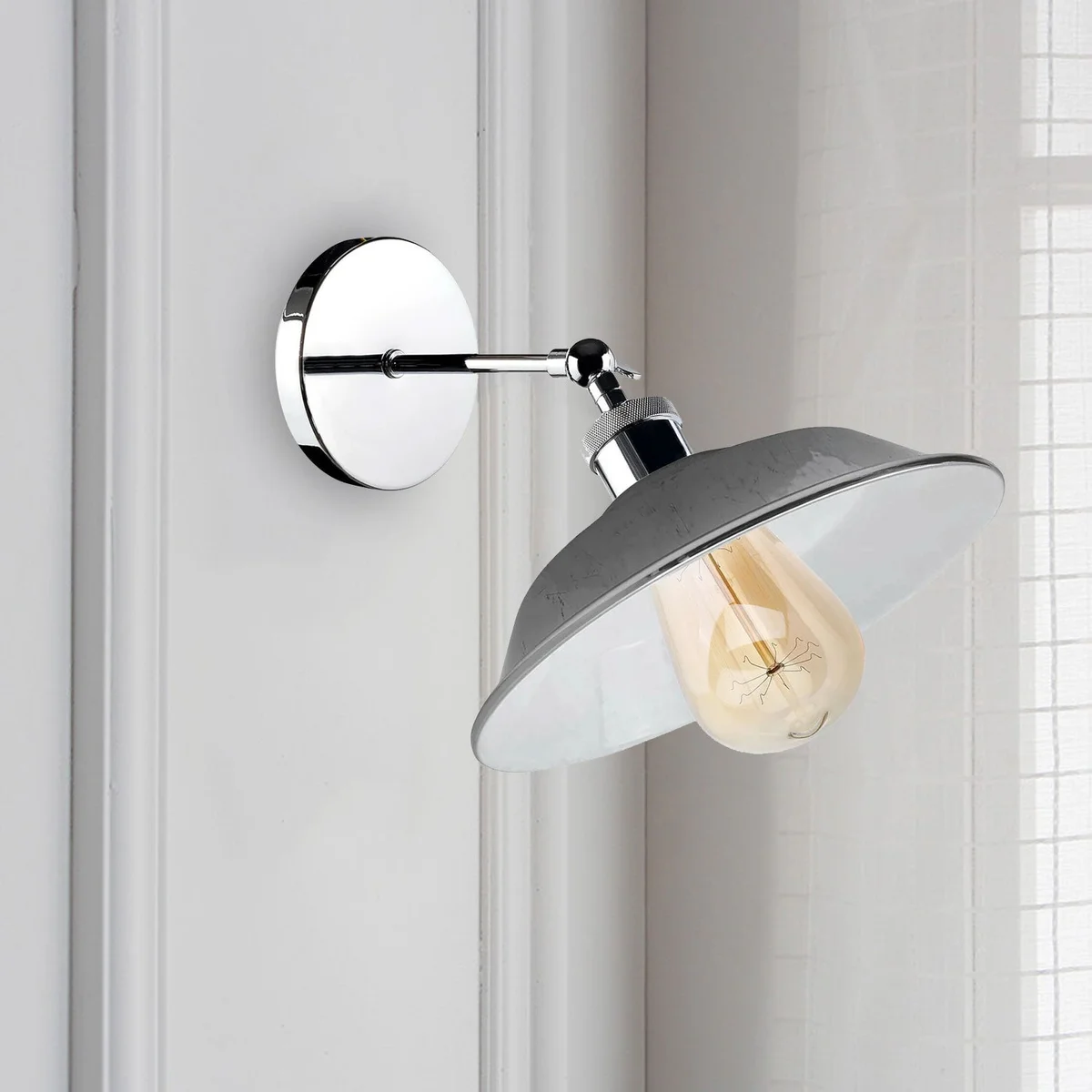 Chrome wall sconce with retro industrial design, adjustable downward bowl-shaped shade, polished metal finish