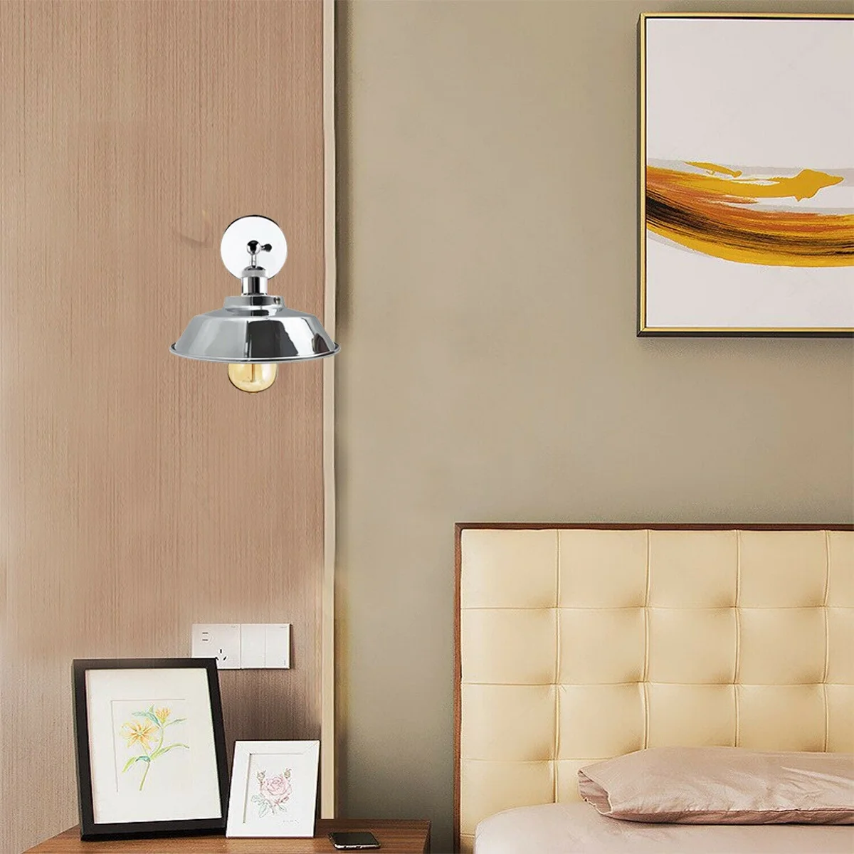 Chrome metal wall sconce with adjustable bowl shade mounted on wall, showcasing retro industrial design and polished finish