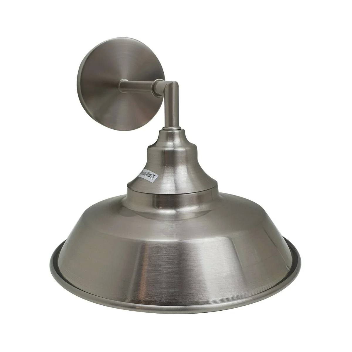 Adjustable antique brass metal wall lamp with satin nickel finish, mounted on a white wall, showcasing 1950s design style
