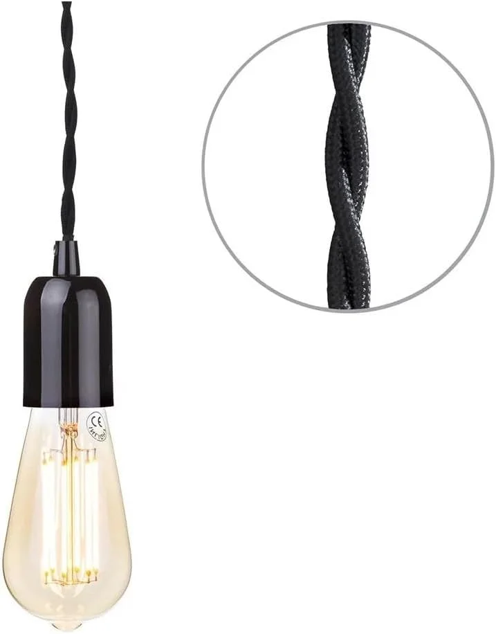 Black vintage pendant ceiling light with metal holder and black twisted cord hanging from ceiling outlet