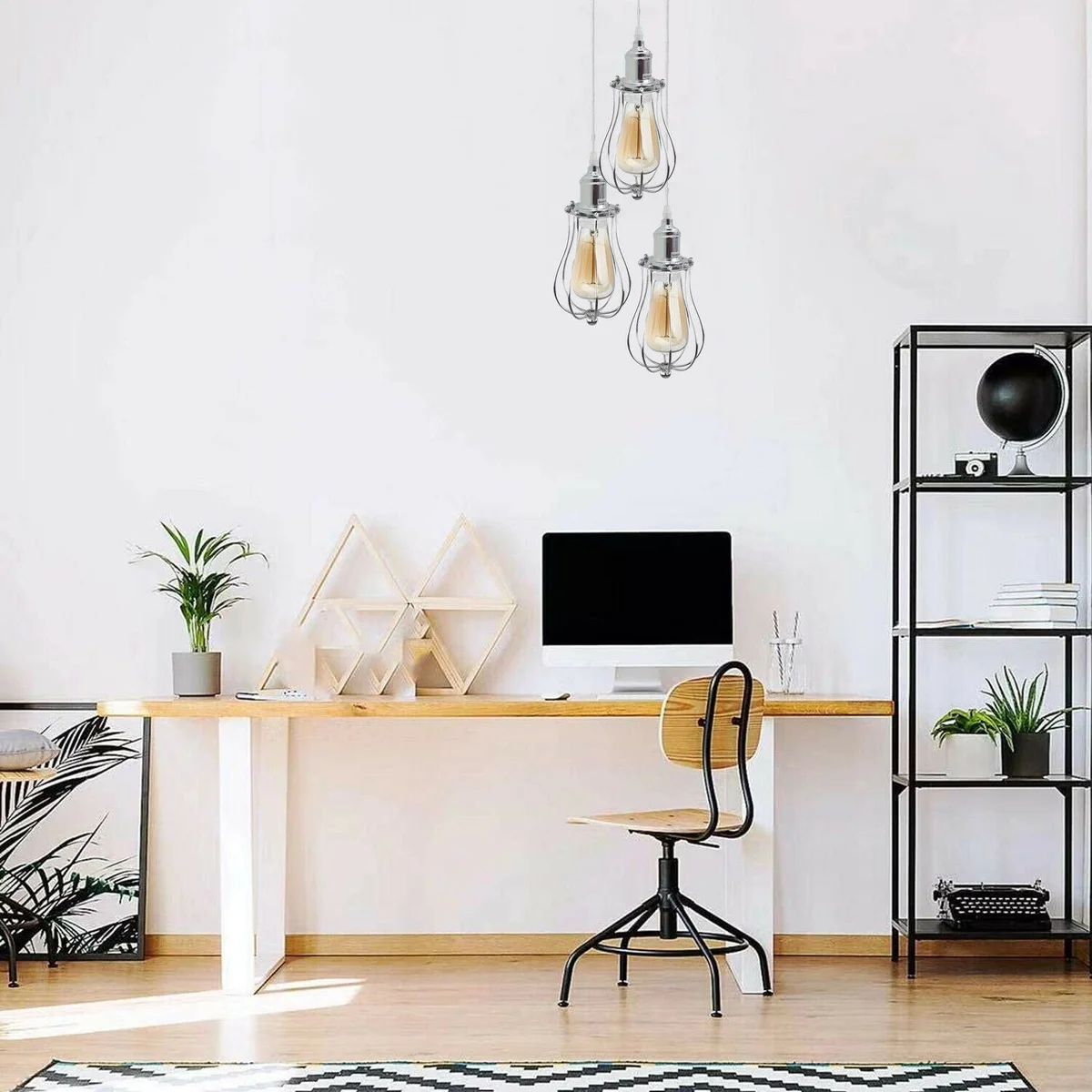 Three-head modern chrome ceiling pendant light with metal cages and PVC cables hanging from ceiling plate