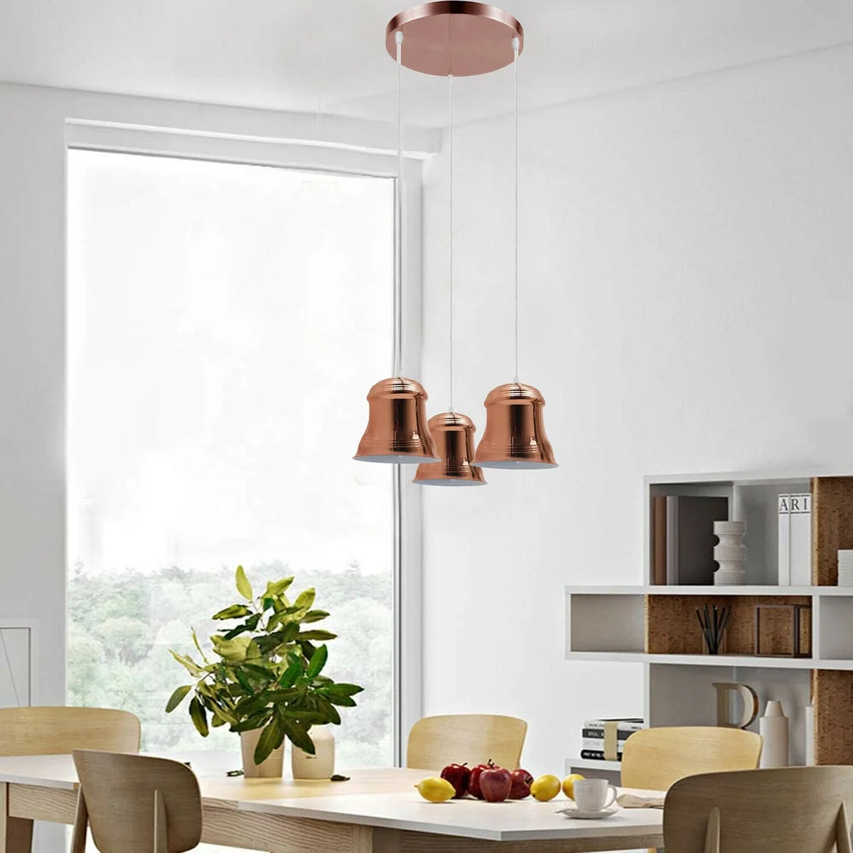 Vintage industrial pendant light with three rose gold, yellow brass, and satin nickel heads hanging from ceiling