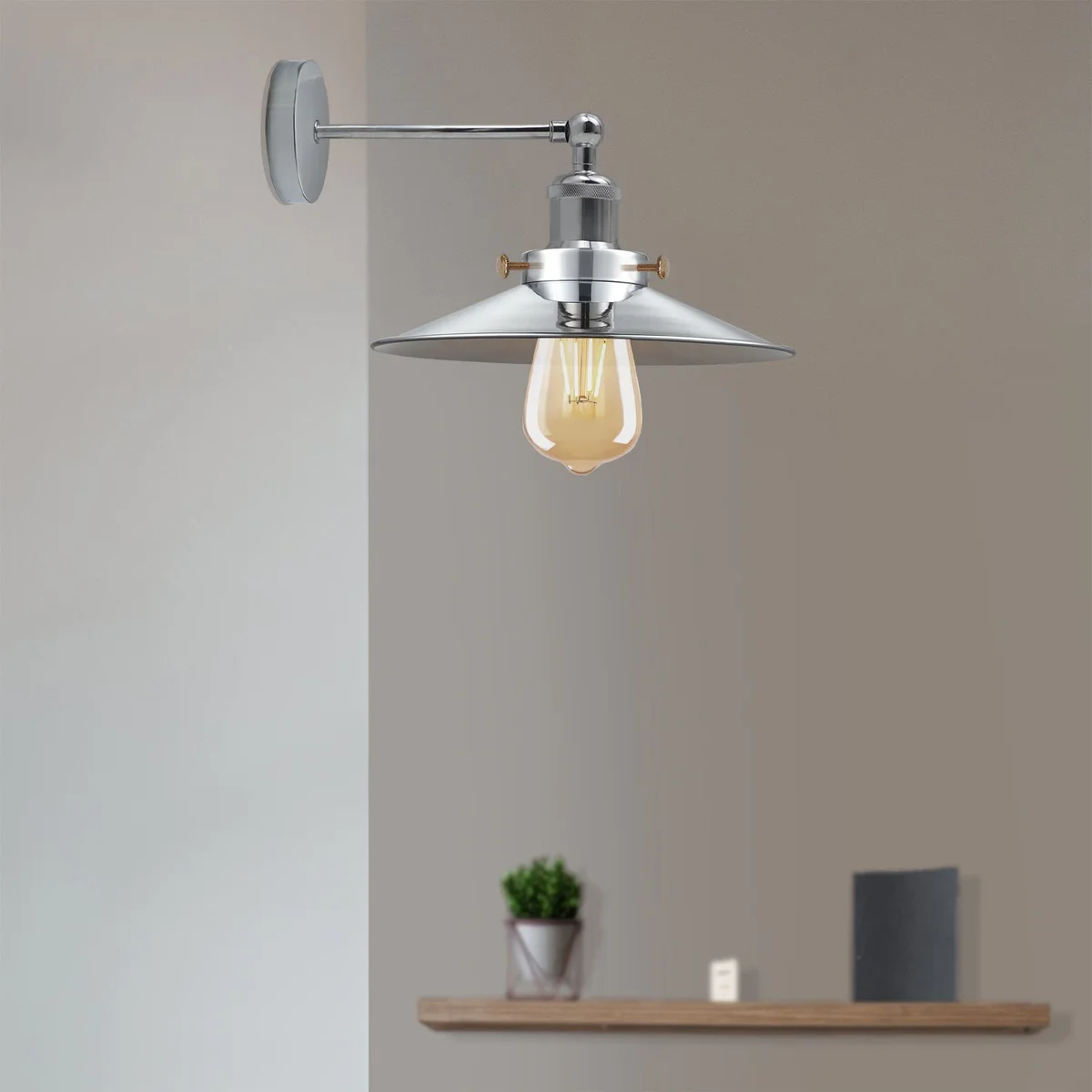 Metal wall sconce with satin nickel finish, cone-shaped shade and exposed E27 holder, adjustable downward lighting.