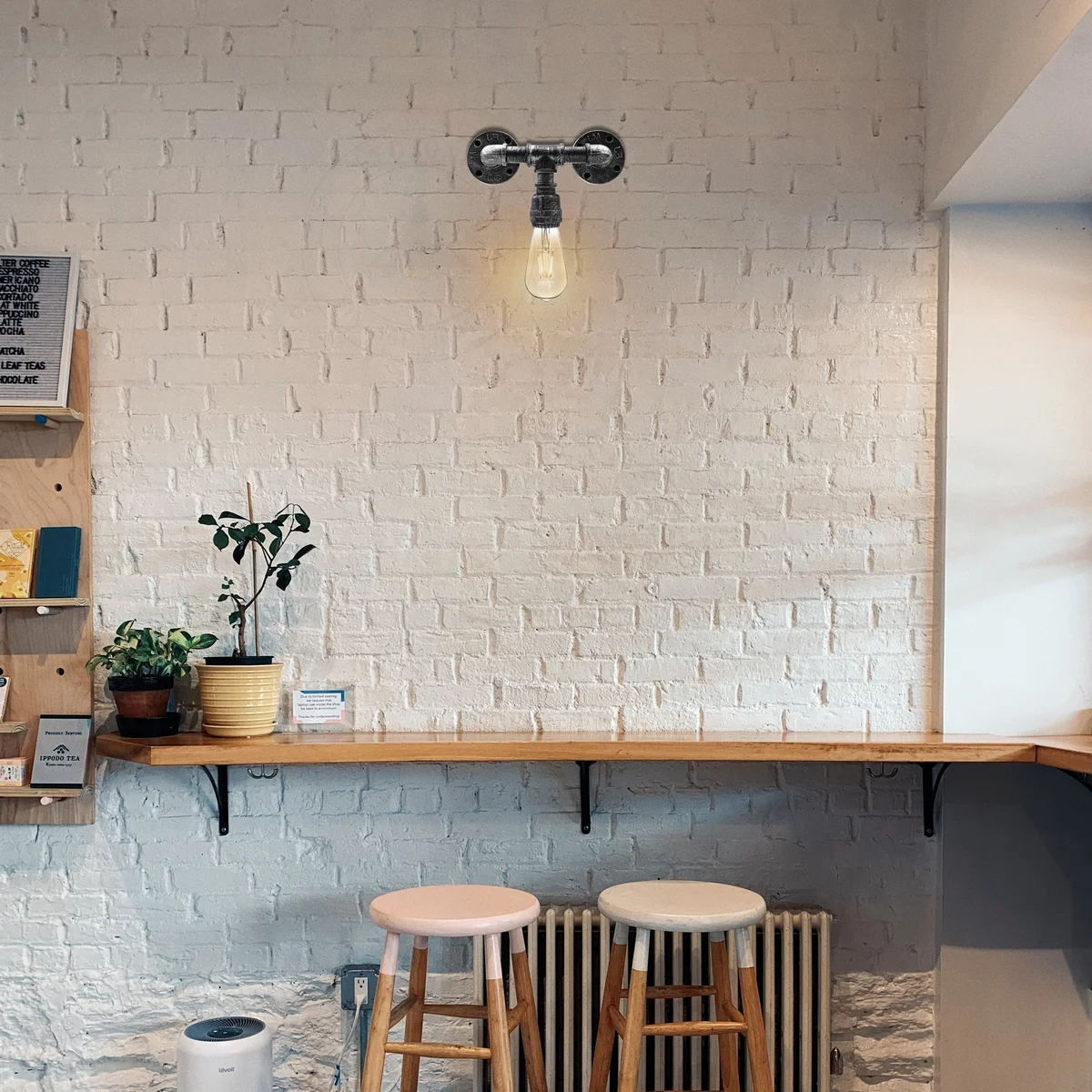 Industrial steampunk wall sconce with black metal water pipe design, two E27 bulb sockets, vintage industrial style