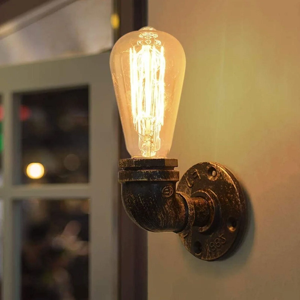 Vintage industrial wall lamp made from metal water pipes with rust finish and exposed bulb, steampunk style wall sconce