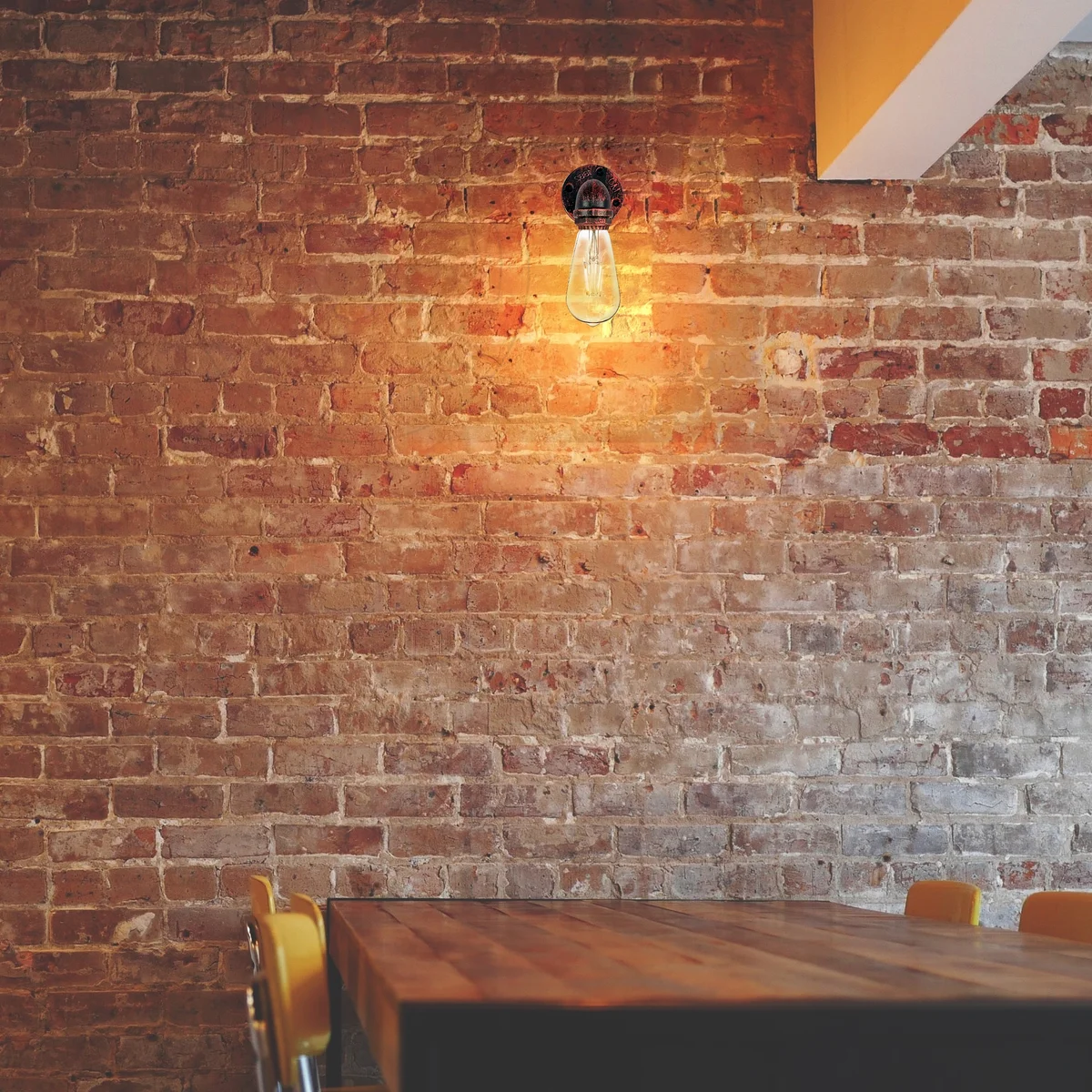 Metal vintage lamp wall sconce in rust color with industrial water pipe design and E27 bulb included, mounted on white wall