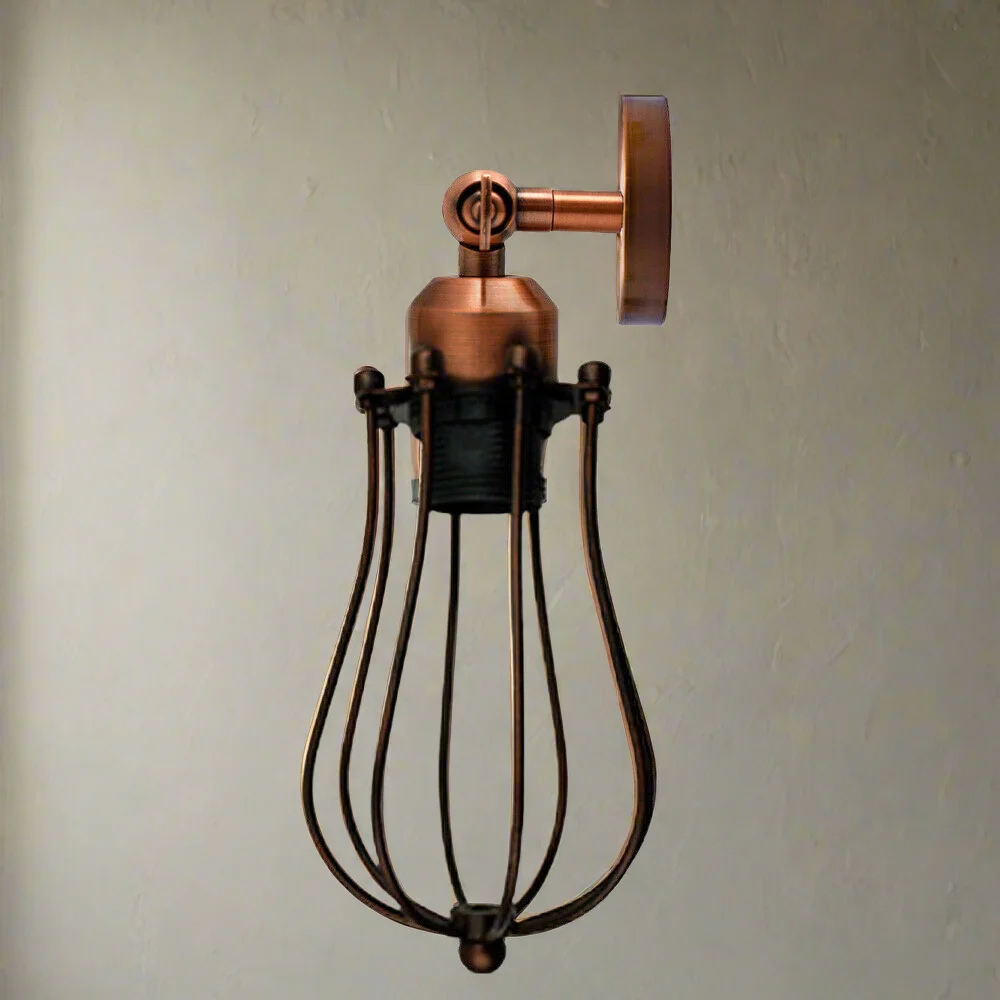 Industrial retro wall lamp with metal cage shade and adjustable arm mounted on white wall
