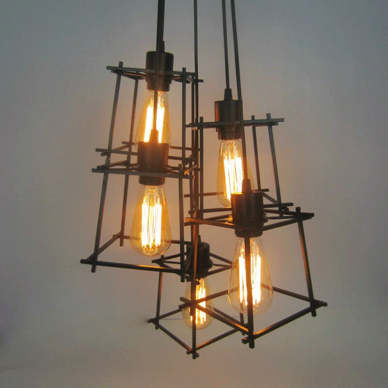 Vintage pendant light with five black metal cage shades hanging from ceiling, industrial retro design for loft décor