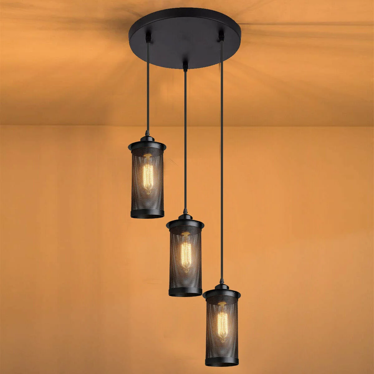 Modern vintage industrial black metal E27 bulb pendant light with perforated cage shades hanging from ceiling rose