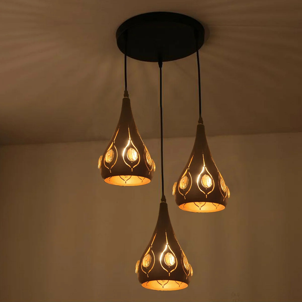 Industrial black pendant light with geometric wire cage design and E27 bulbs hanging from adjustable cables
