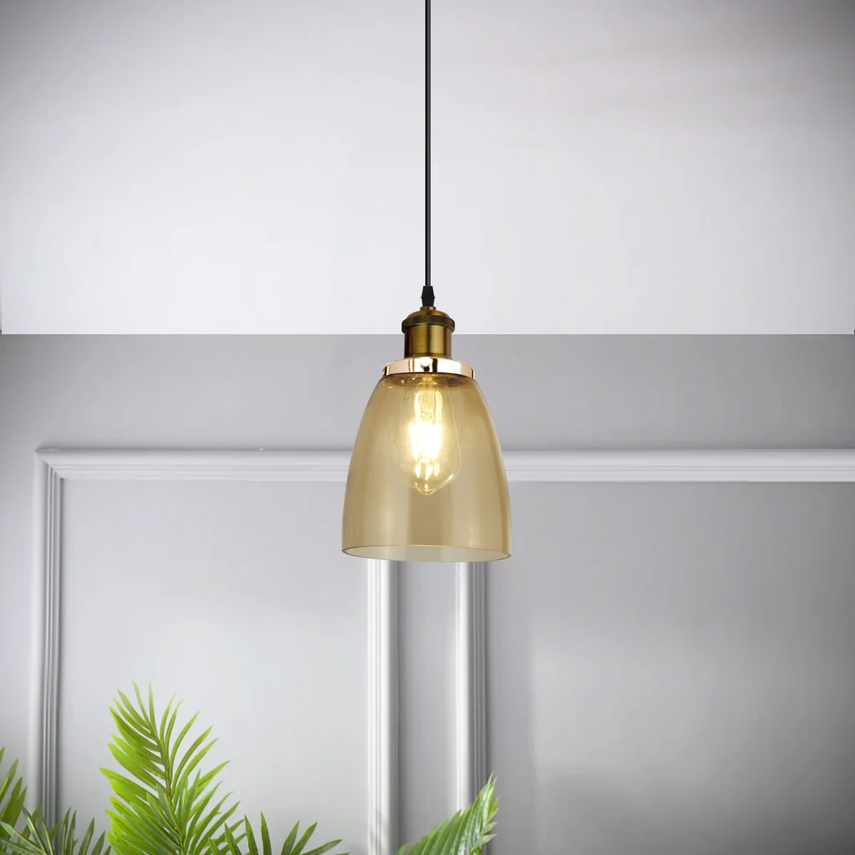Vintage retro style amber glass pendant light with bell-shaped shade and sturdy glass construction hanging from ceiling