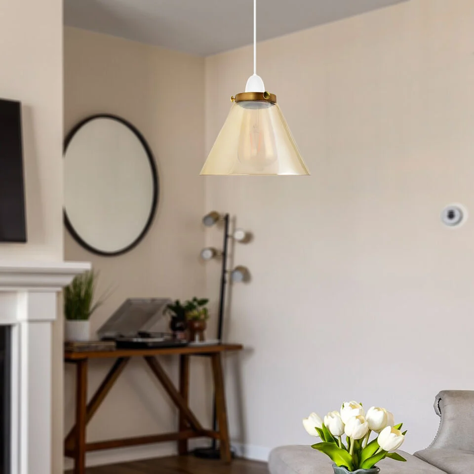 Vintage amber industrial glass lampshade with bowl shape, E27 fitting, glowing warmly in indoor setting