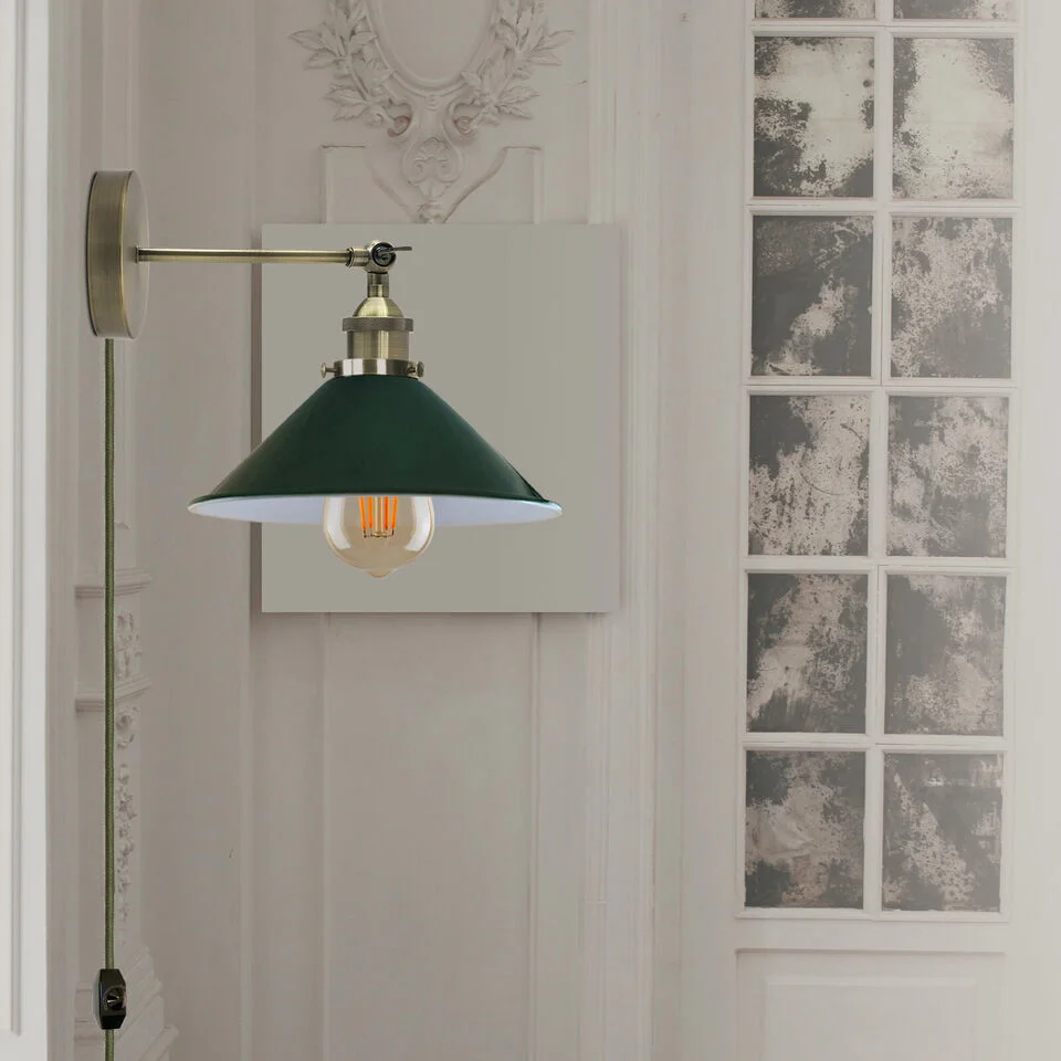 Black metal plug in wall light with cone shade, adjustable arm, and 2m cord with dimmer switch on white wall